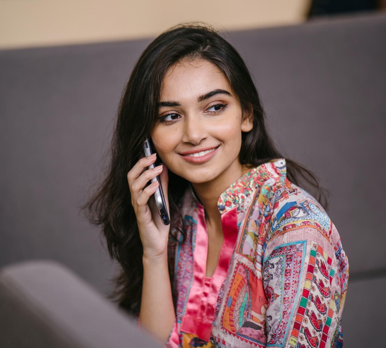 photo-of-smiling-woman-talking-on-phone
